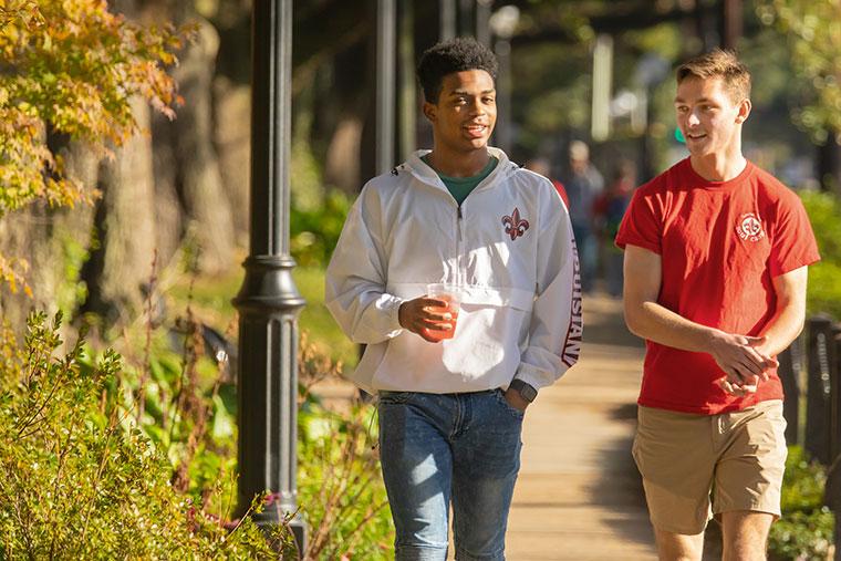 Two Bryman College students walking on the sidewalk
